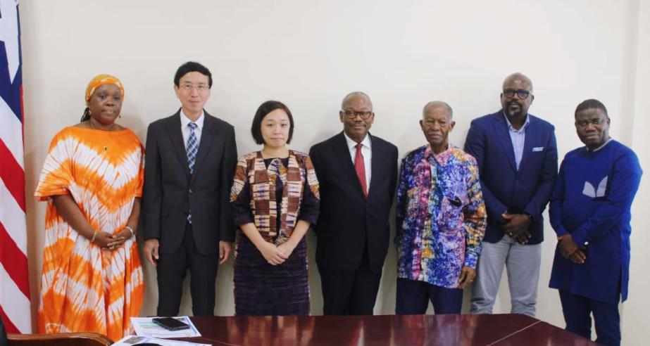 Public Works Minister Hon. Roland L. Giddings (second from right) with some Senior Government Officials and JICA Representatives at the signing ceremony for the construction of a 1.7km road corridor.